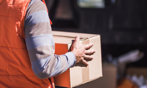 A cardboard box being carried.