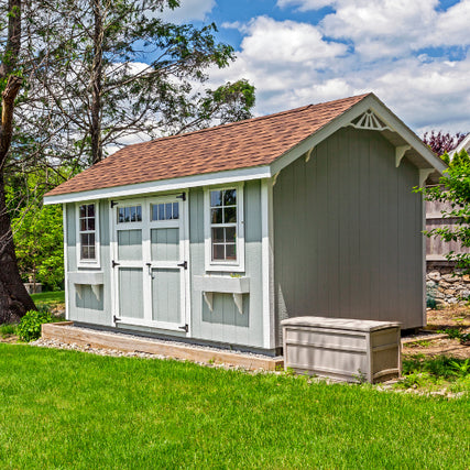 Portable BuildingsA gray shed placed in a back yard.
