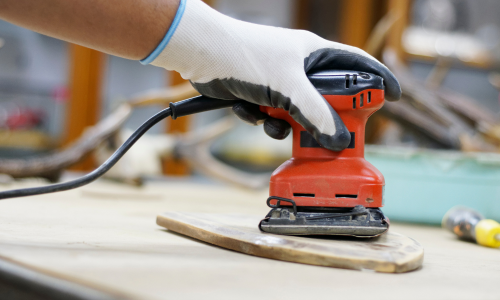 A close-up of an electric sander.